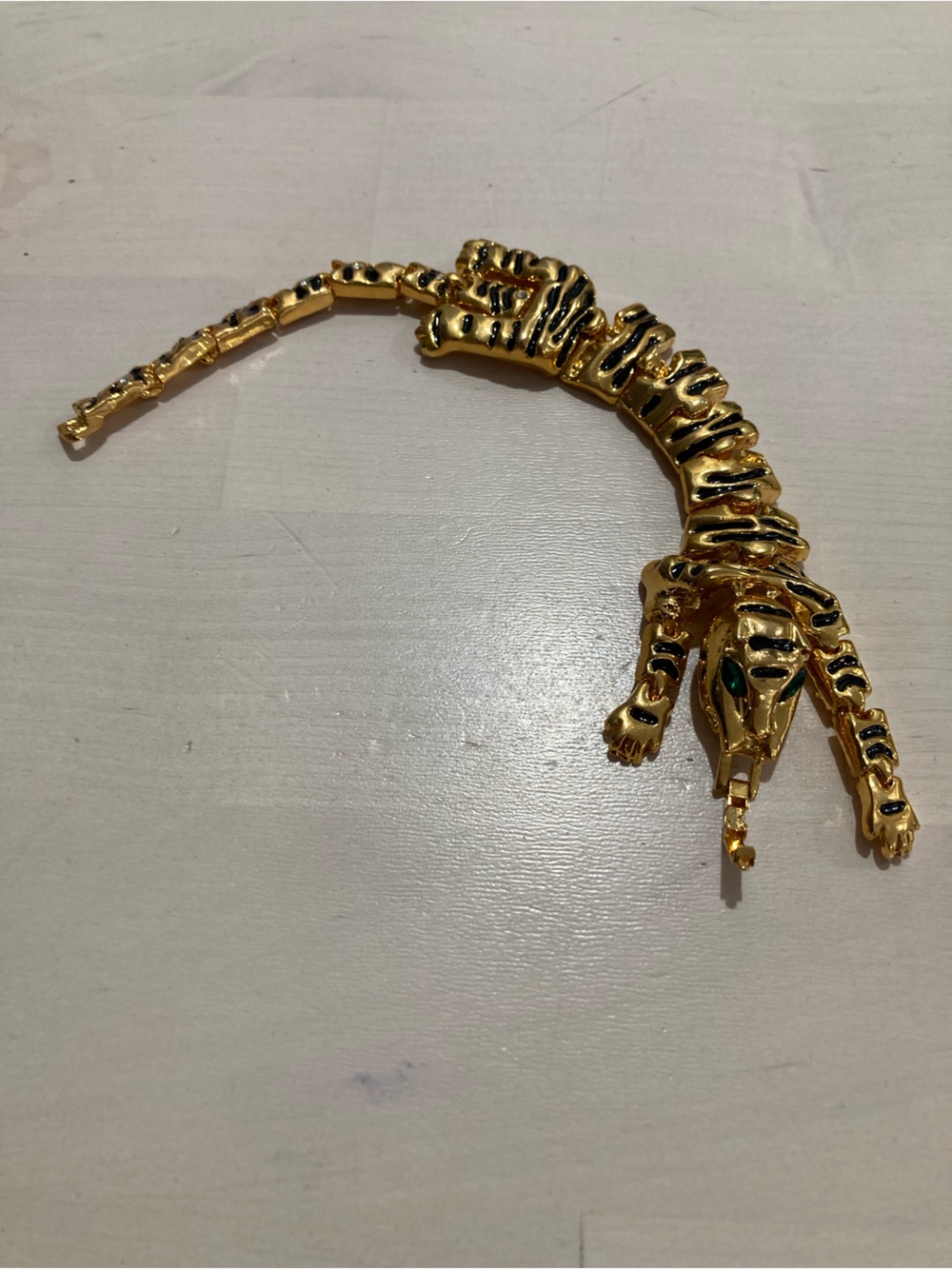 Gold-tone Tiger Bracelet with green crystal eyes and Black Enamel Accents